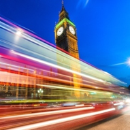 london bridge big ben houses of parliament light trails bus blue sky red white starburst long exposure motion blue