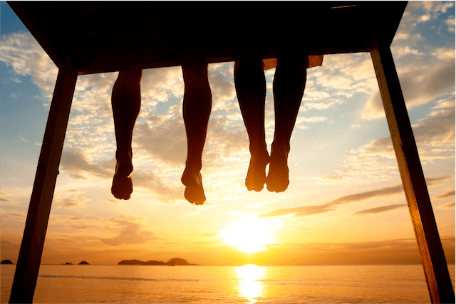 legs pier sunset feet toes silhouette dangling summer orange yellow black