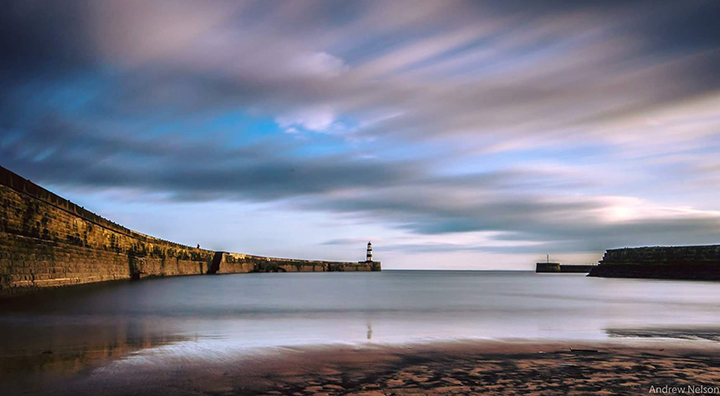 water harbour long exposure calm sky landscape lighthouse