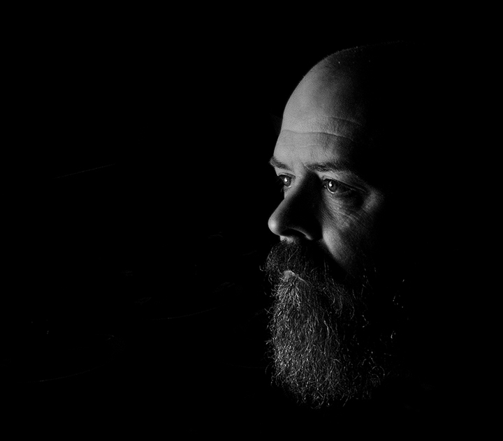 man portrait black and white beard low key lighting photography