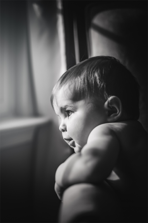 subject portrait black and white looking window candid