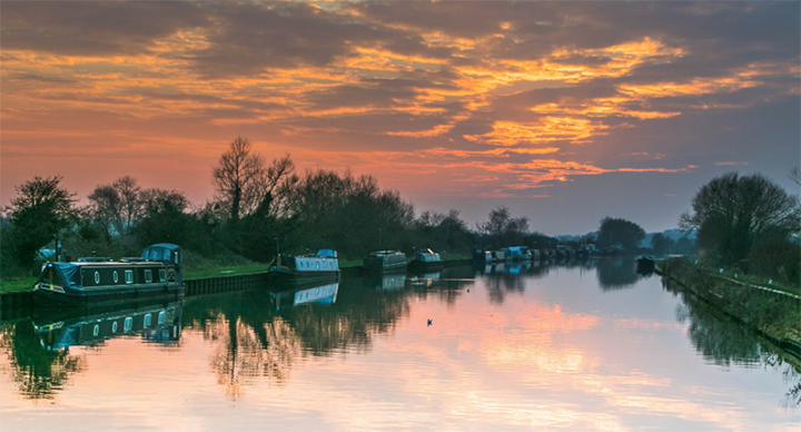 barge canal water reflection sunset landscape