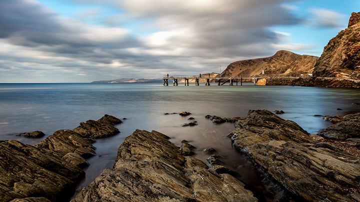 landscape pier water rocks sky long exposure pier