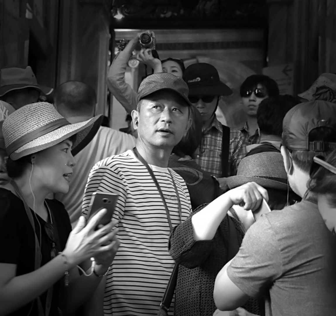 portrait black and white man head camera stripes tourist