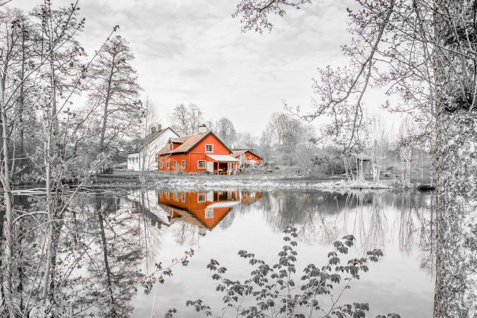 house lake monochome red split colour reflection