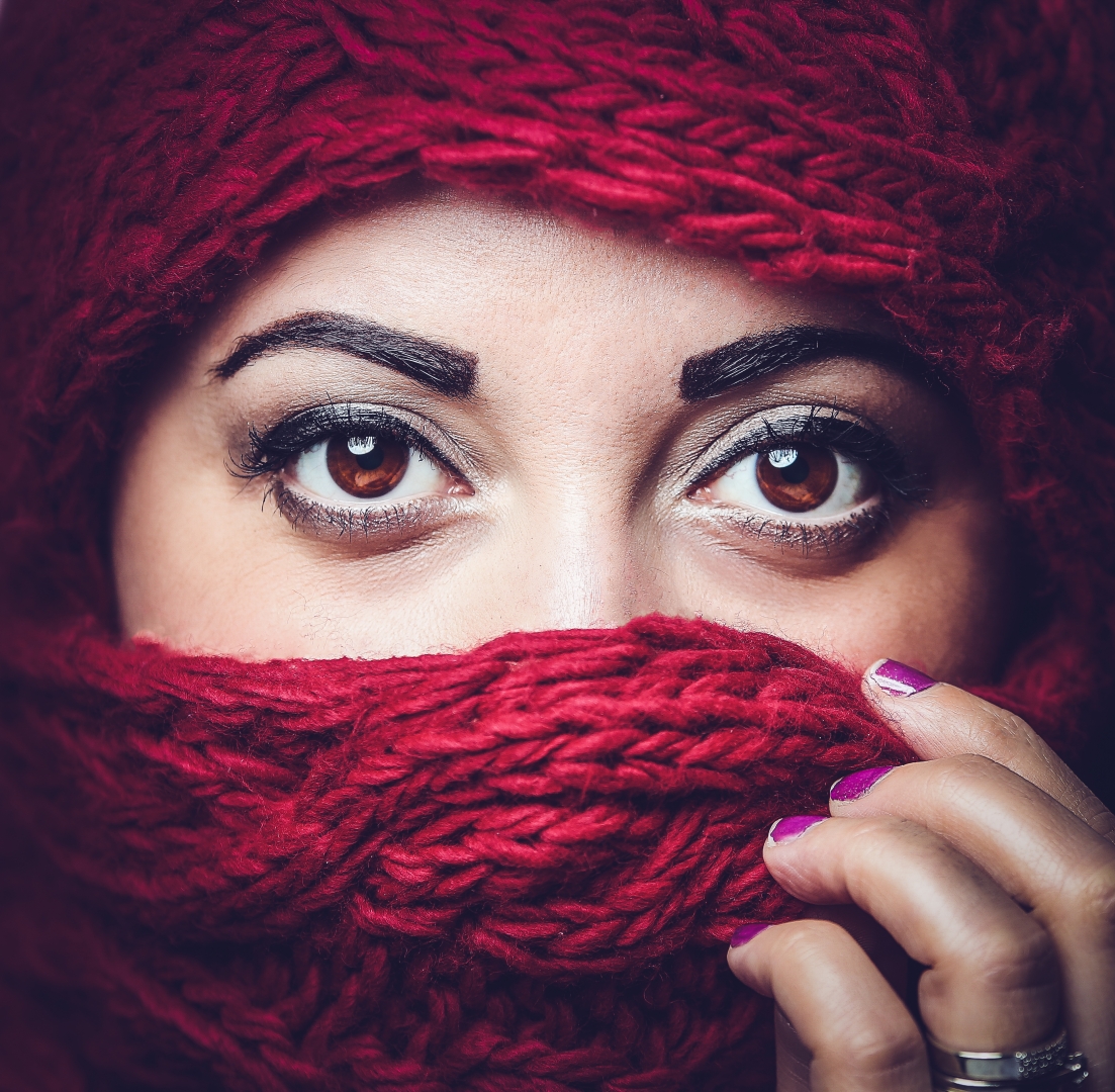 eyes red scarf hands purple finger nails face close up