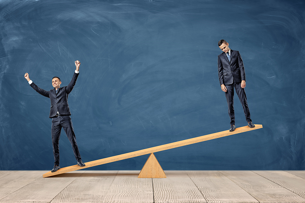 men balance see-saw suits creative block