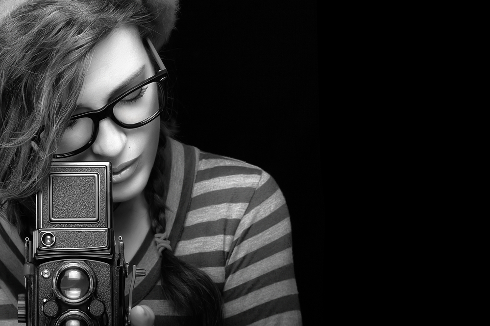 girl photographer camera black and white hair stripes glasses TLR viewfinder world photo day