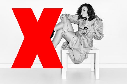model table black and white leaning bodysuit red cross incorrect chair