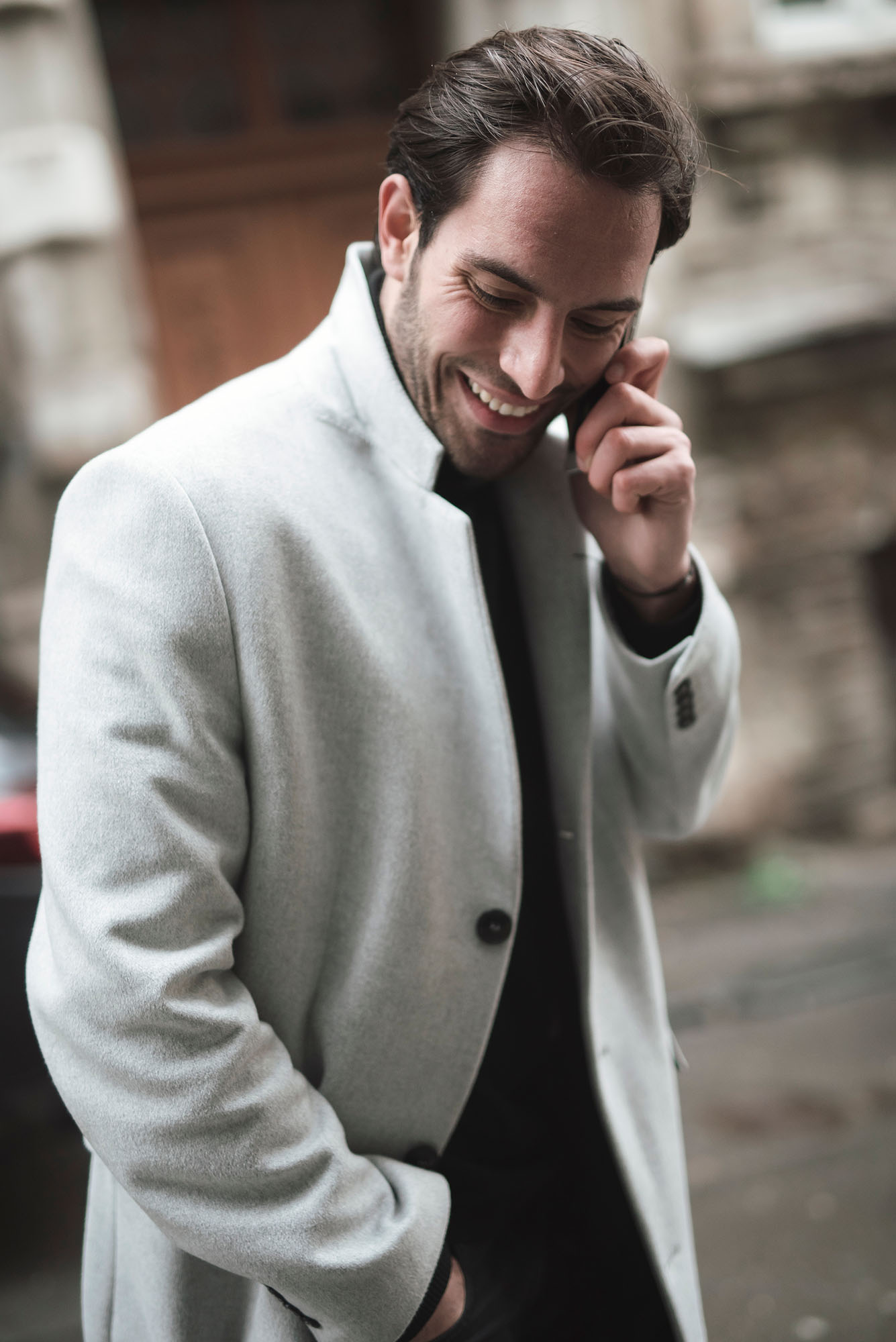 man talking on phone white coat street photography portrait city people camera subject light how to tutorial guide