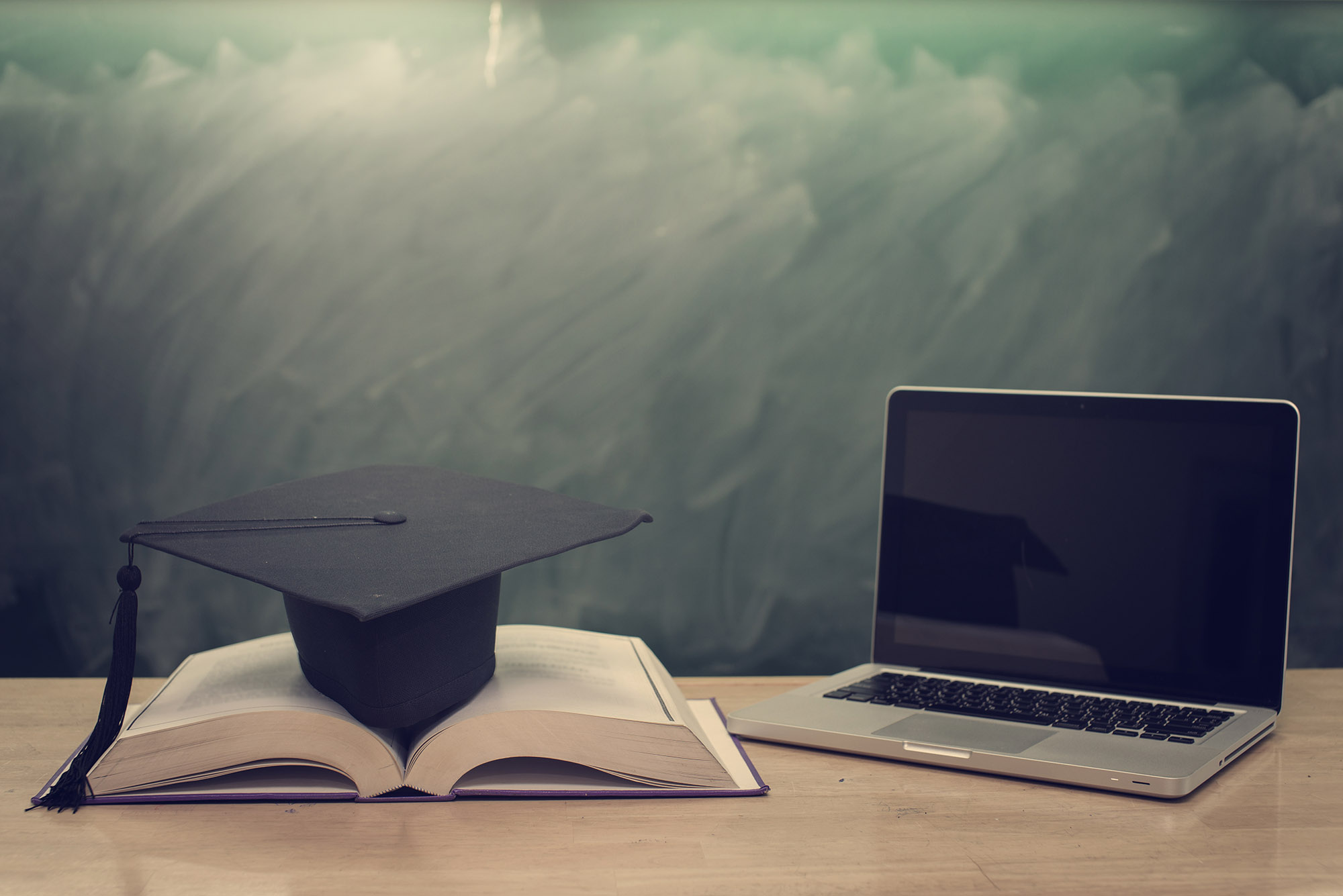 college degree graduation cap computer online training course