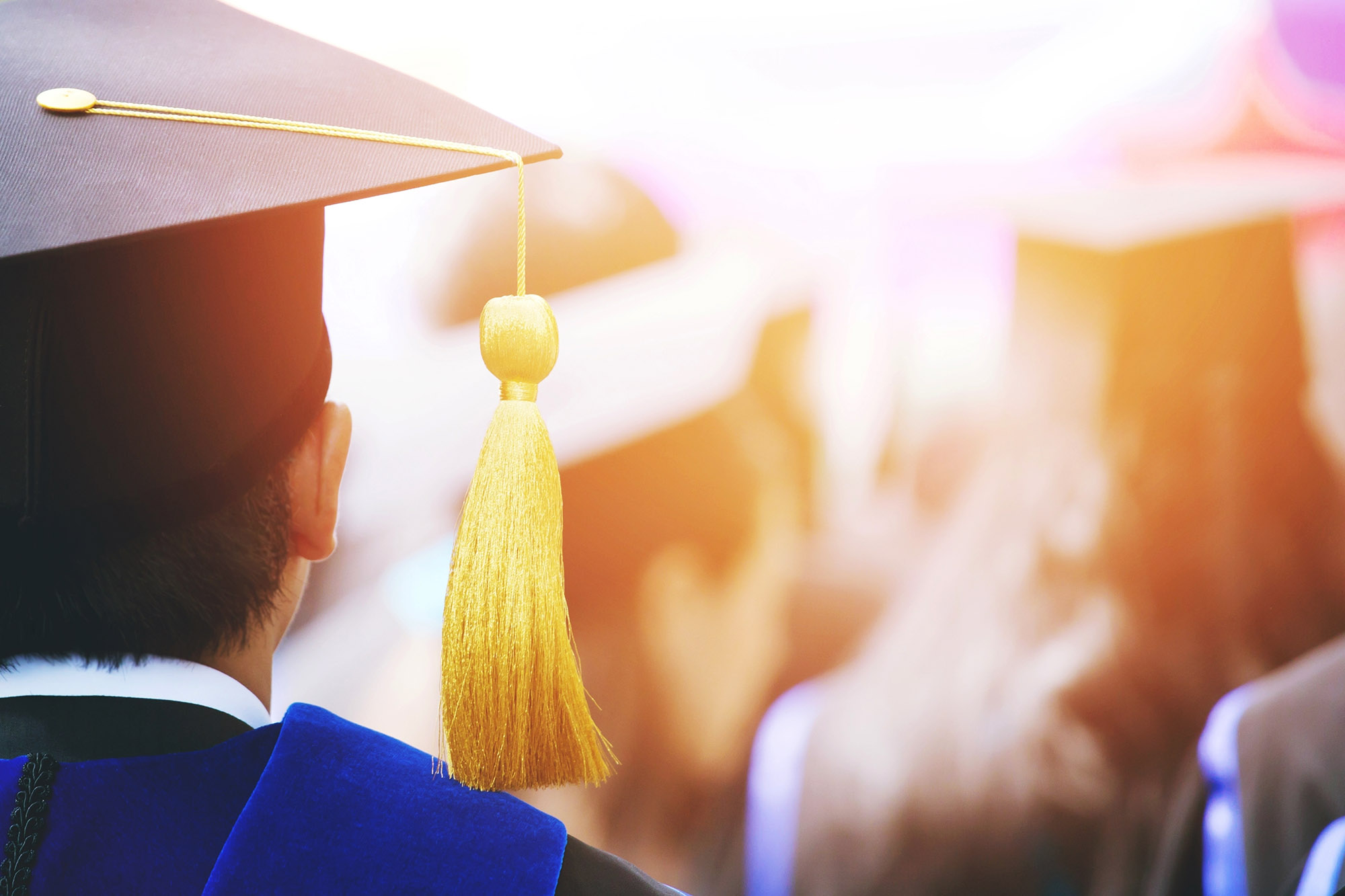 graduate college university cap matriculate yellow tassel ceremony