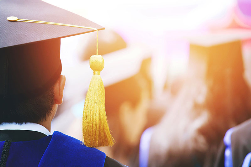 graduate college university cap matriculate yellow tassel ceremony